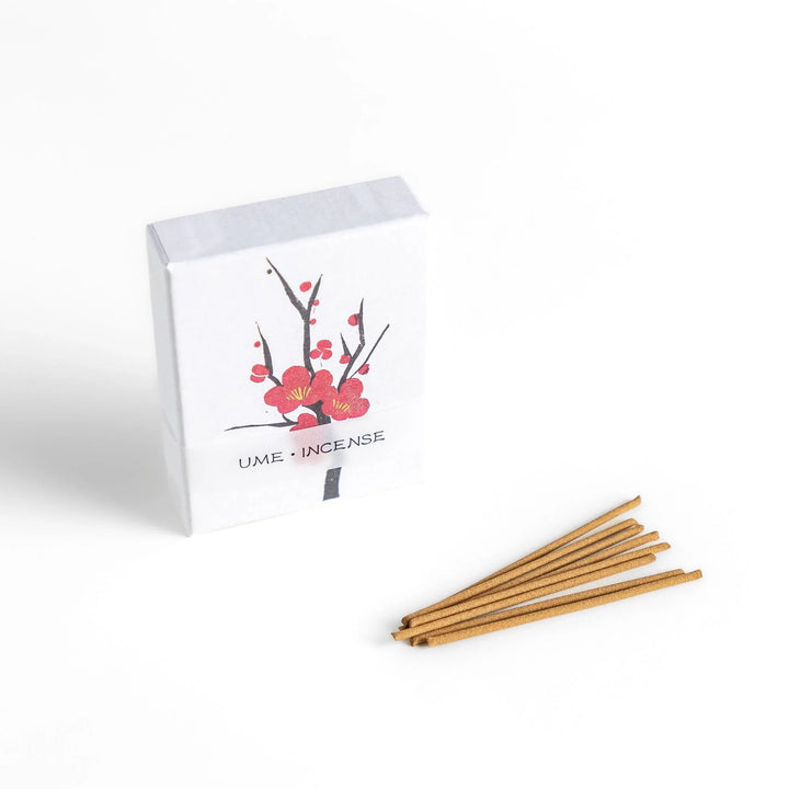 Japanese plum blossom incense with warm brown sticks in illustrated box offering sweet subtle floral fragrance.