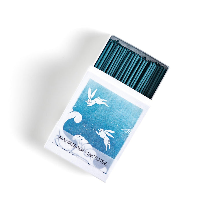 Blue incense sticks in a box with Japanese wave and rabbit design offering a refreshing and calming scent.