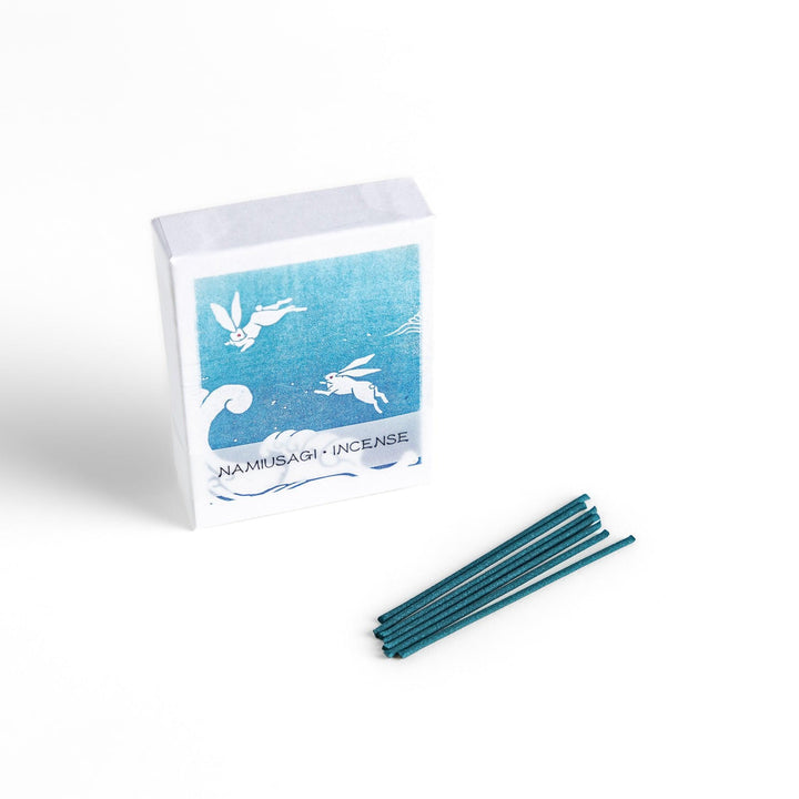 Blue incense sticks in a box with Japanese wave and rabbit design offering a refreshing and calming scent.