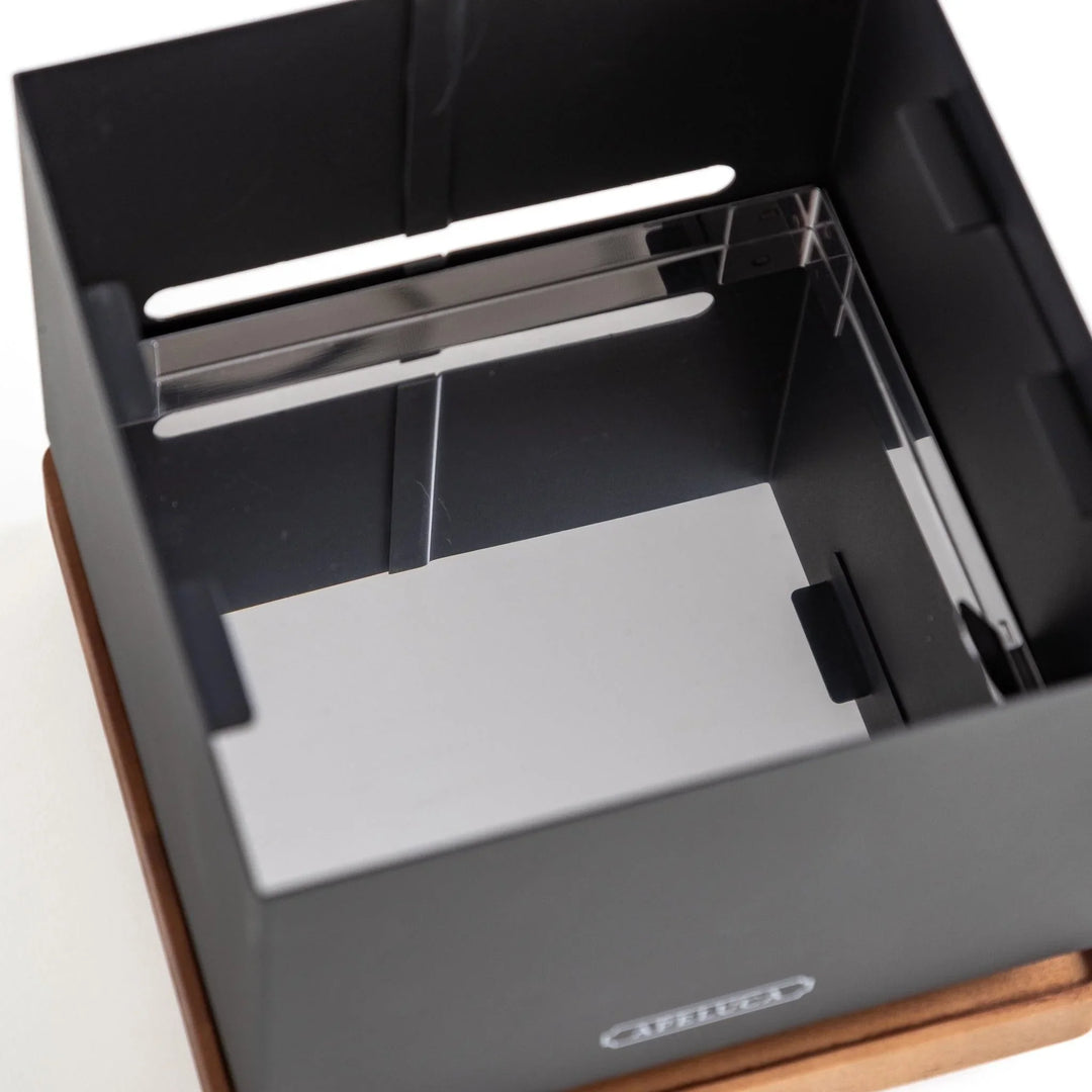 A black box with a reflective mirror interior, showcasing a sleek and minimalist design.