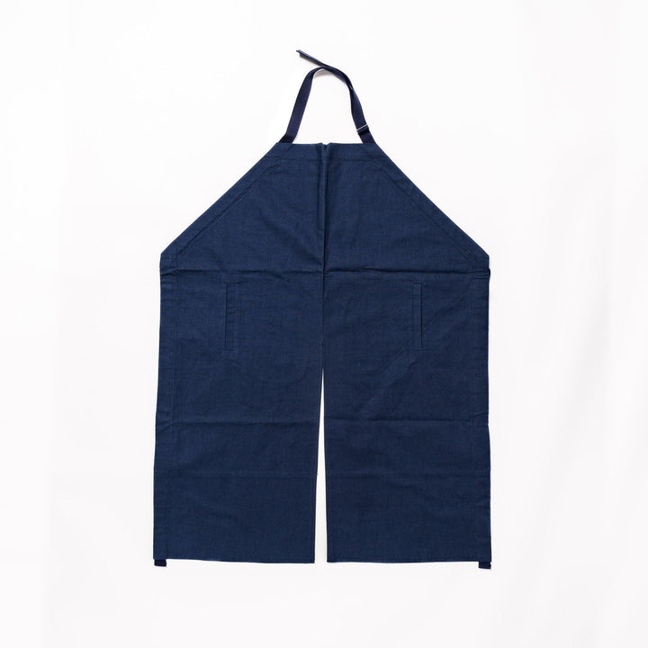 Stylish navy blue Japanese apron from our kitchen linens collection, featuring pockets and adjustable straps.