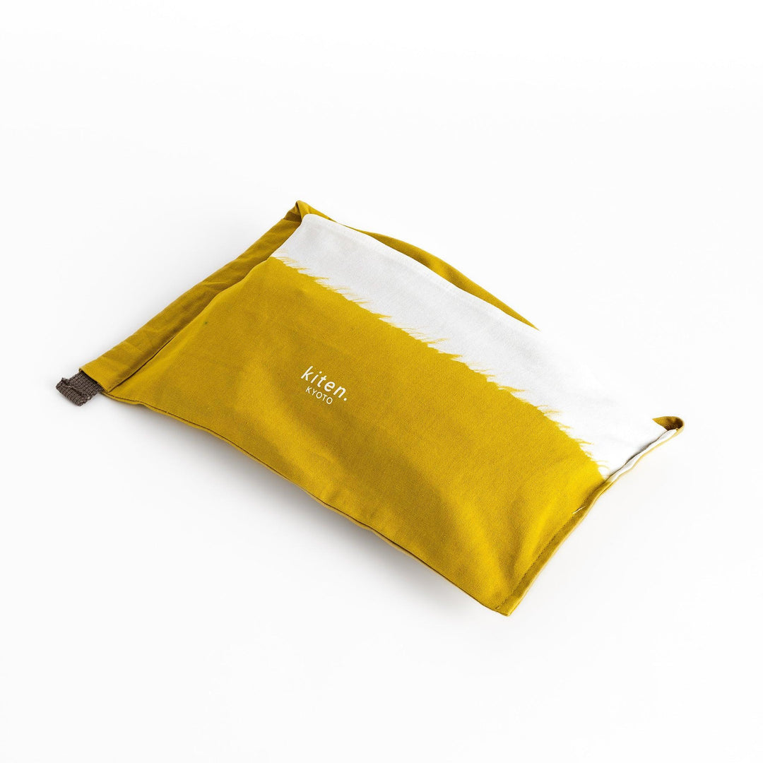 Stylish mustard yellow Japanese apron from our kitchen linens collection, featuring pockets and adjustable straps.