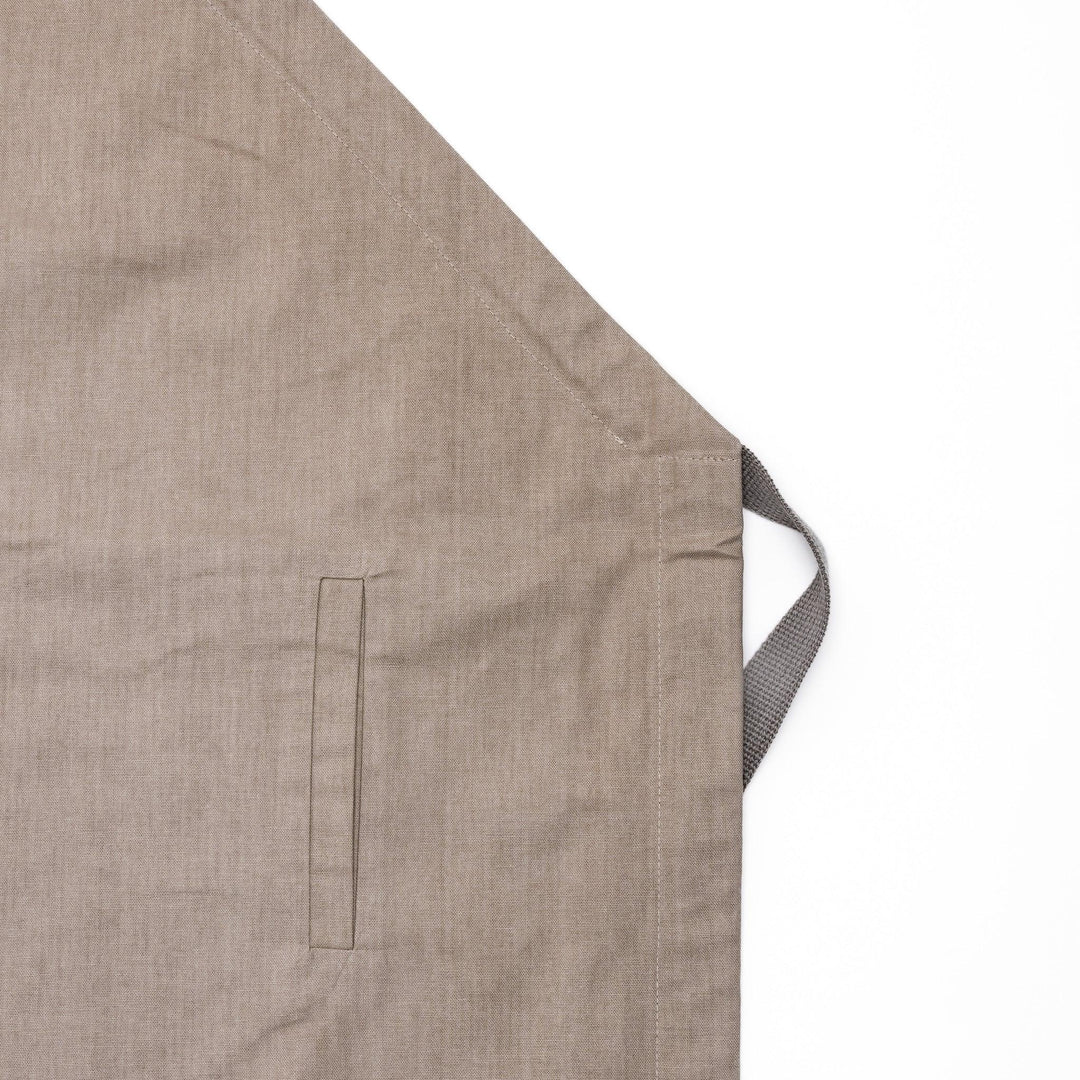 Elegant beige Japanese apron from our kitchen linens collection, designed with pockets and adjustable straps.