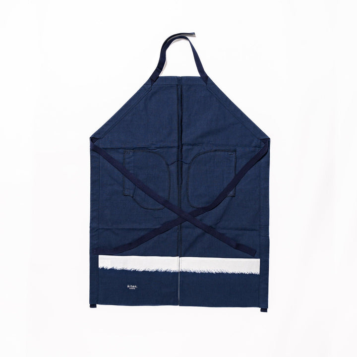 Stylish navy blue Japanese apron from our kitchen linens collection, featuring pockets and adjustable straps.