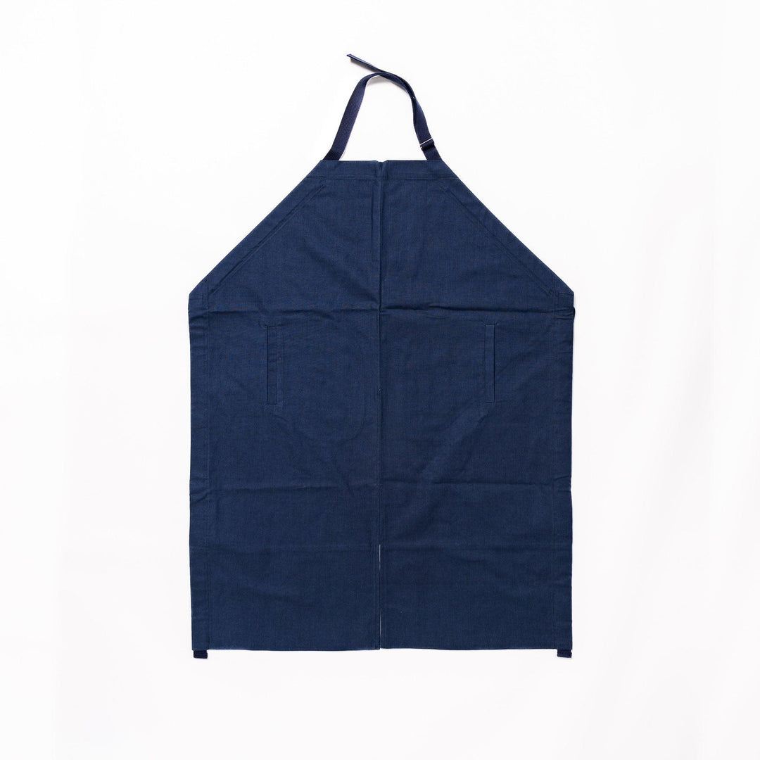 Stylish navy blue Japanese apron from our kitchen linens collection, featuring pockets and adjustable straps.