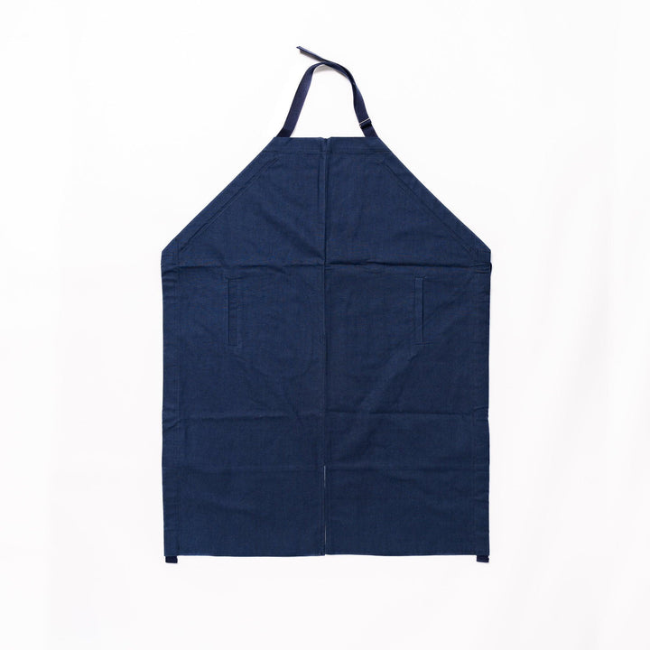 Stylish navy blue Japanese apron from our kitchen linens collection, featuring pockets and adjustable straps.