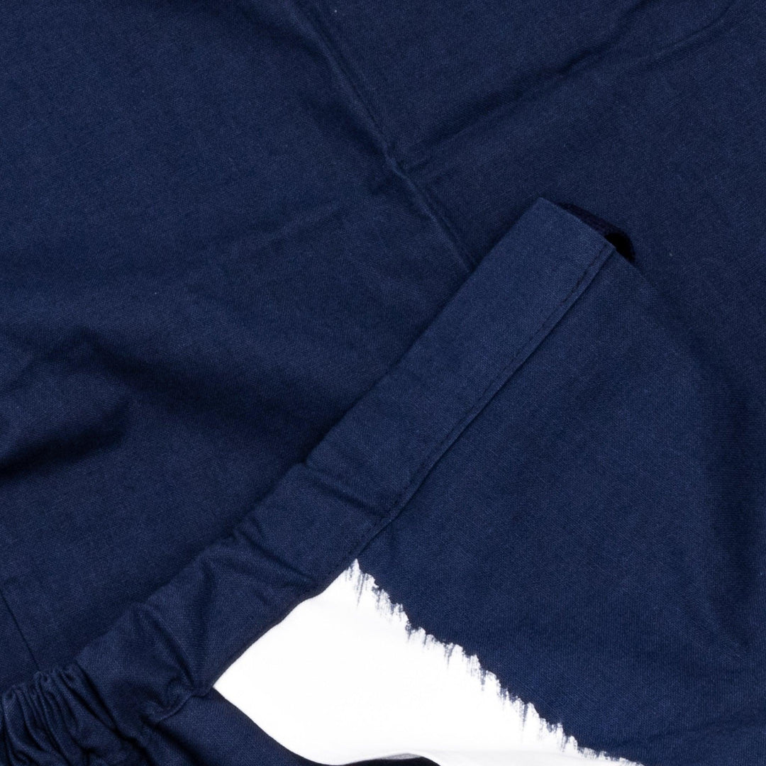 Stylish navy blue Japanese apron from our kitchen linens collection, featuring pockets and adjustable straps.