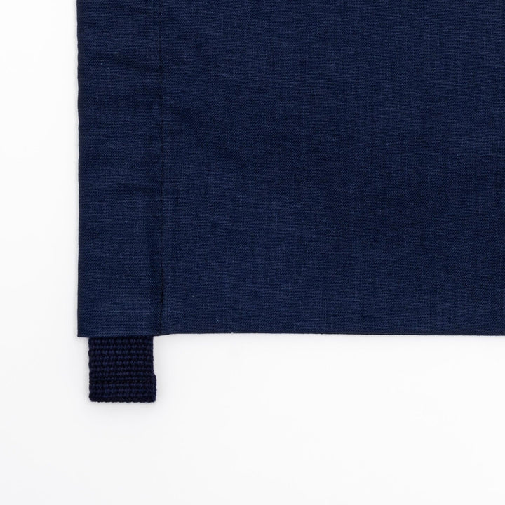 Stylish navy blue Japanese apron from our kitchen linens collection, featuring pockets and adjustable straps.