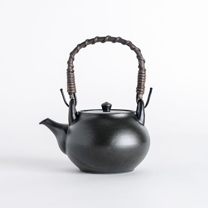 Matte black Japanese tea set featuring teapot and cups offering refined minimalist design for tea time.