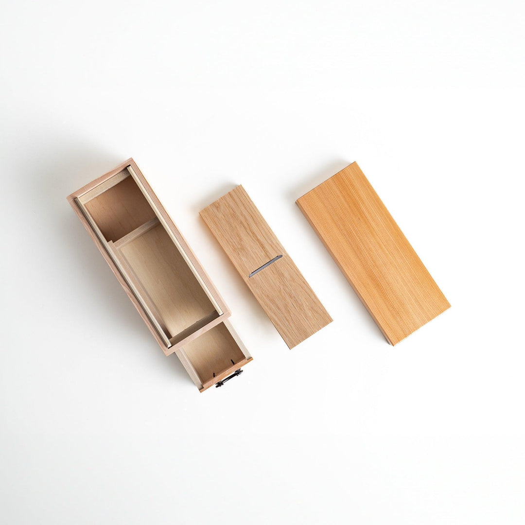 Japanese wooden katsuobushi shaver box with drawer and lid for bonito flakes featuring traditional artwork.