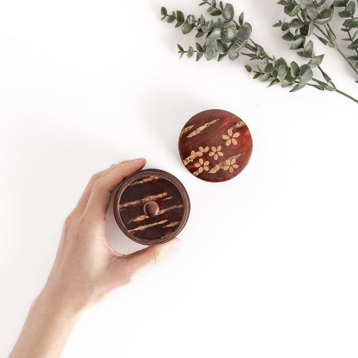 Cherry bark tea canister with cherry blossom design perfect for storing and preserving loose leaf tea.