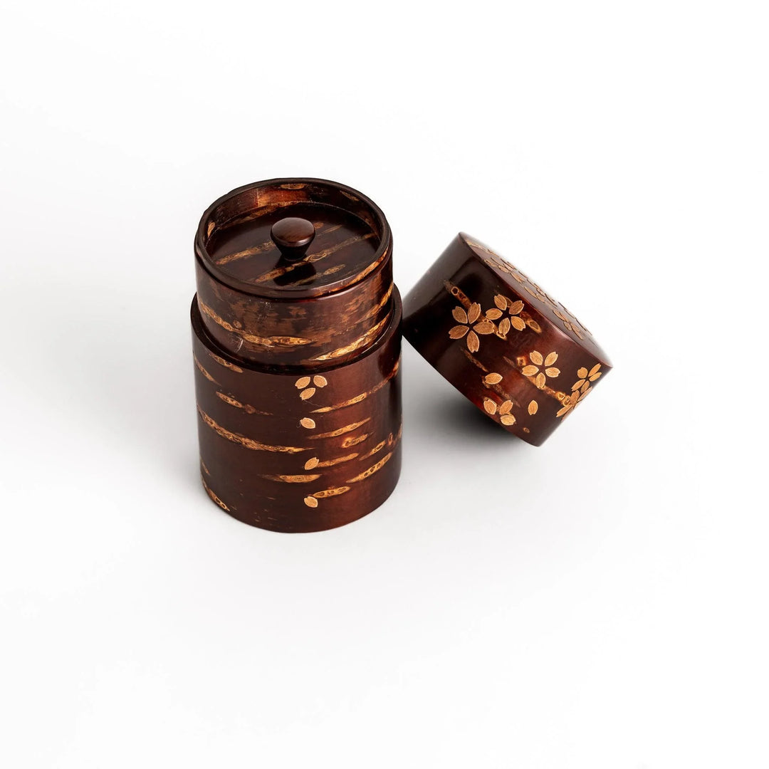Cherry bark tea canister with cherry blossom design perfect for storing and preserving loose leaf tea.