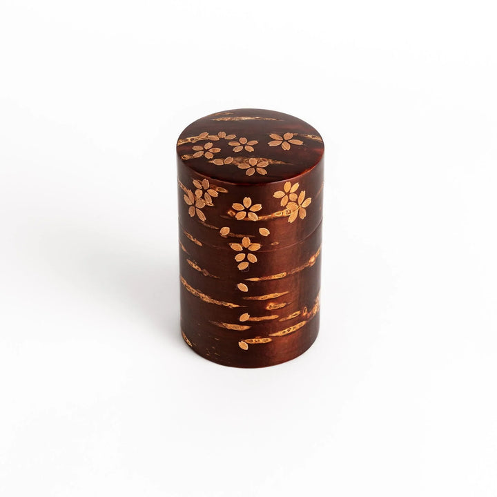Cherry bark tea canister with cherry blossom design perfect for storing and preserving loose leaf tea.