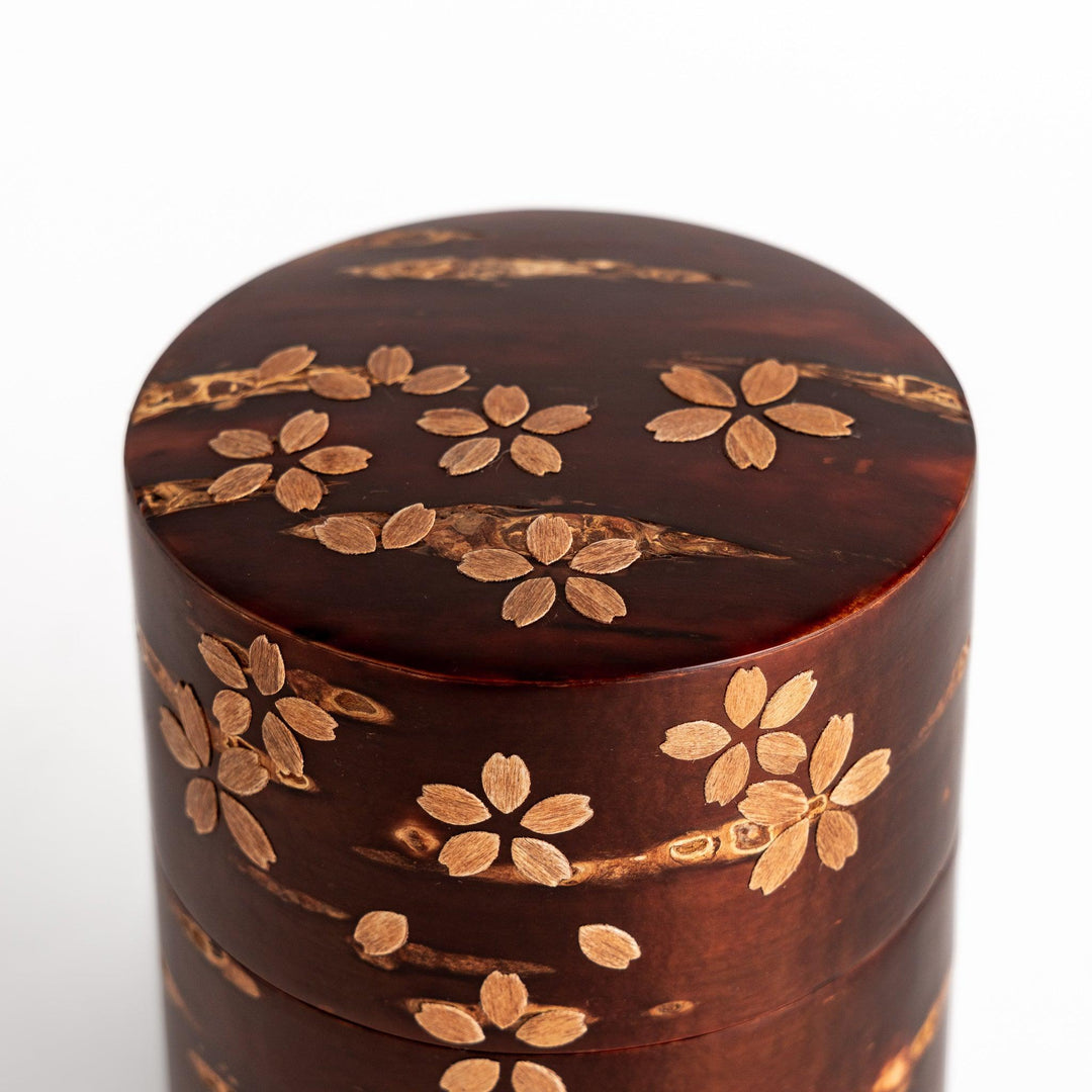 Cherry bark tea canister with cherry blossom design perfect for storing and preserving loose leaf tea.