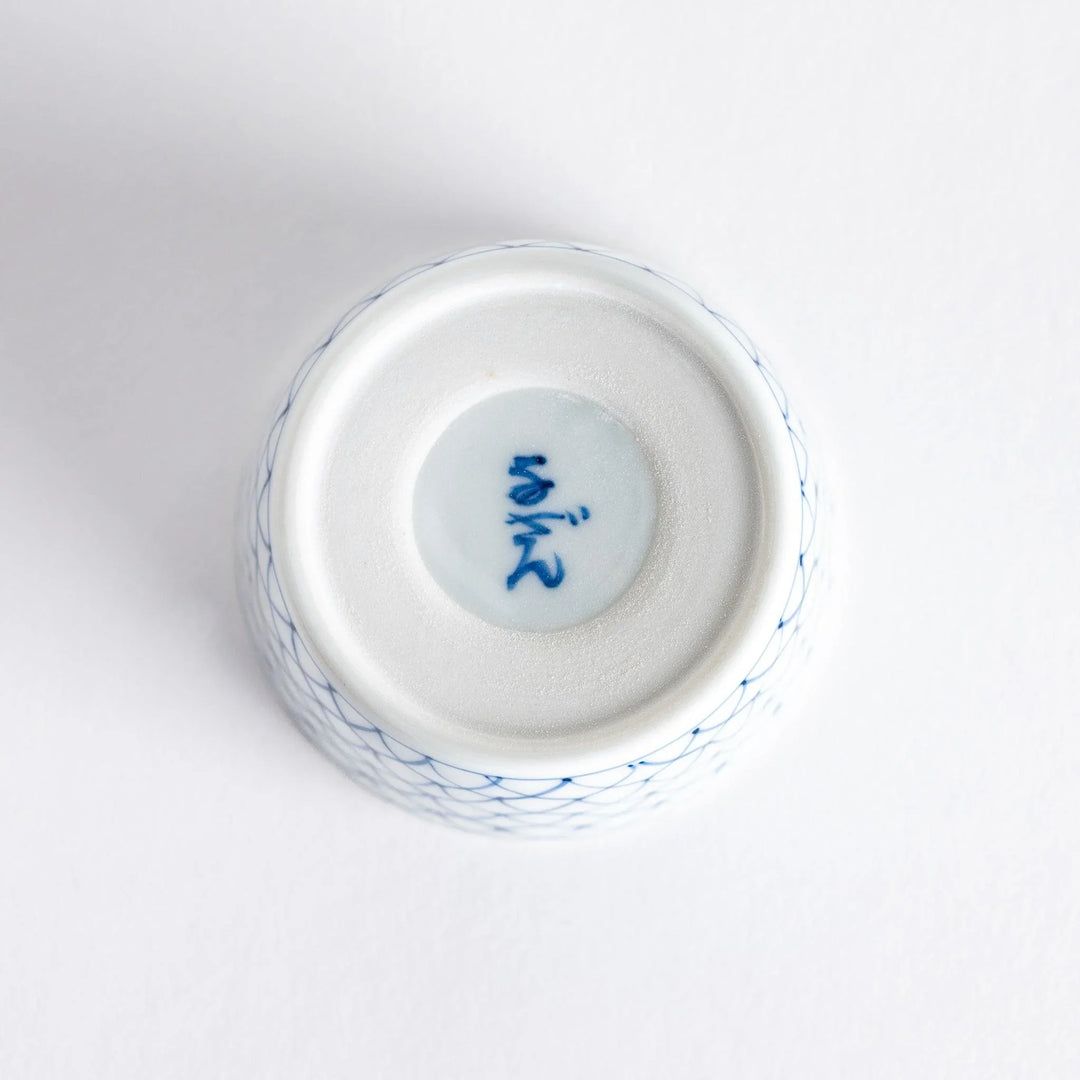 Small white condiment bowl with a blue mesh pattern.