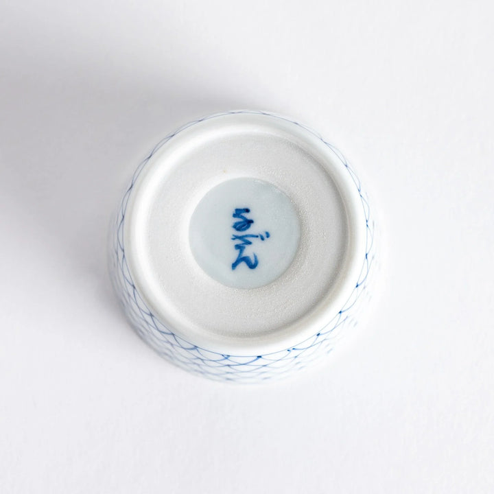 Small white condiment bowl with a blue mesh pattern.