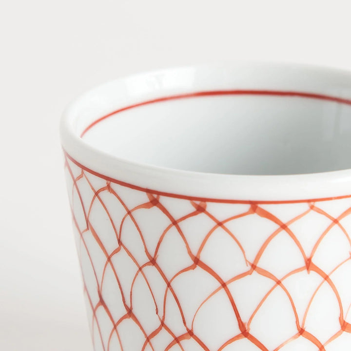 Small white condiment bowl with a blue mesh pattern.