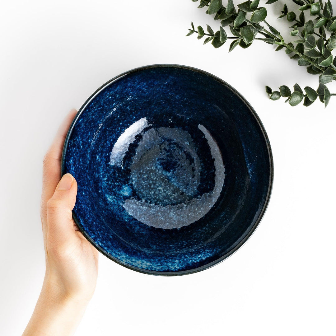 Midnight blue ramen bowl with a glossy glaze, featuring a subtle, textured finish and a slight footed base for stability.