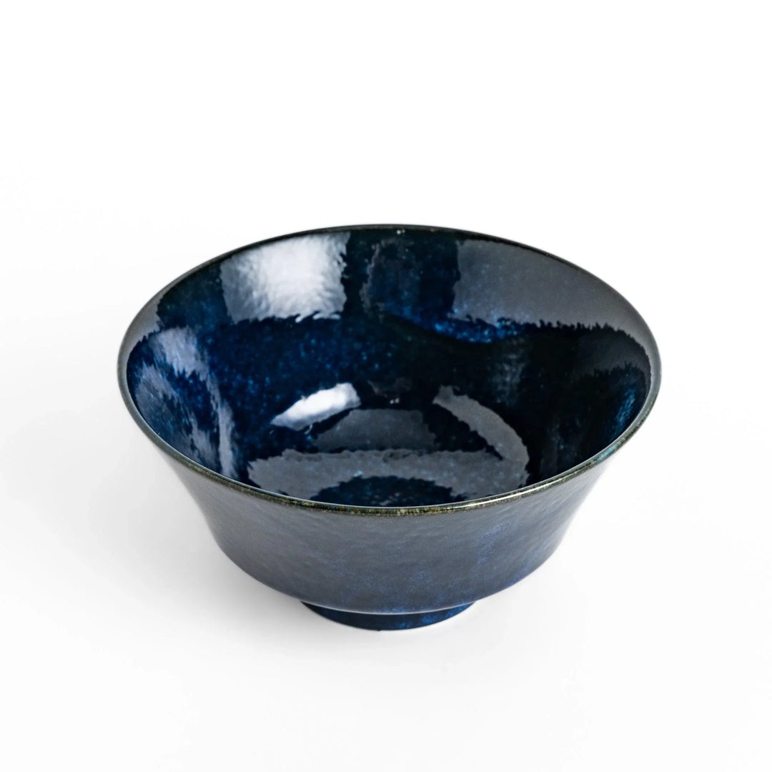 Midnight blue ramen bowl with a glossy glaze, featuring a subtle, textured finish and a slight footed base for stability.