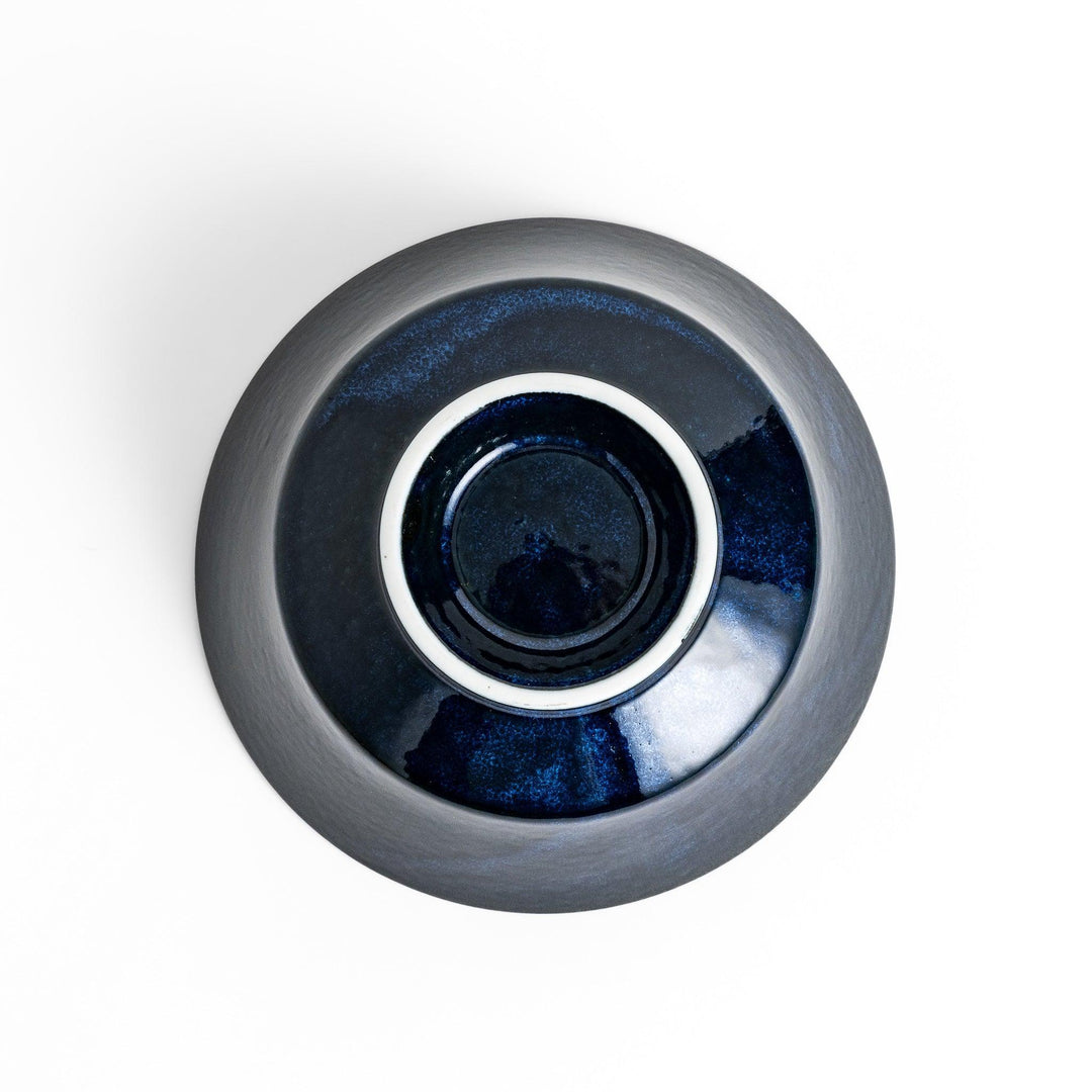 Midnight blue ramen bowl with a glossy glaze, featuring a subtle, textured finish and a slight footed base for stability.