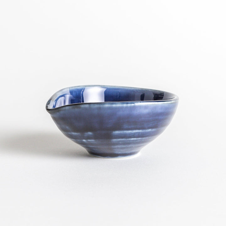 A small condiment bowl in deep, glossy blue.