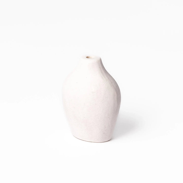 White ceramic bud vase with dried flowers, perfect for adding simple, elegant Japanese-inspired decor to any space.
