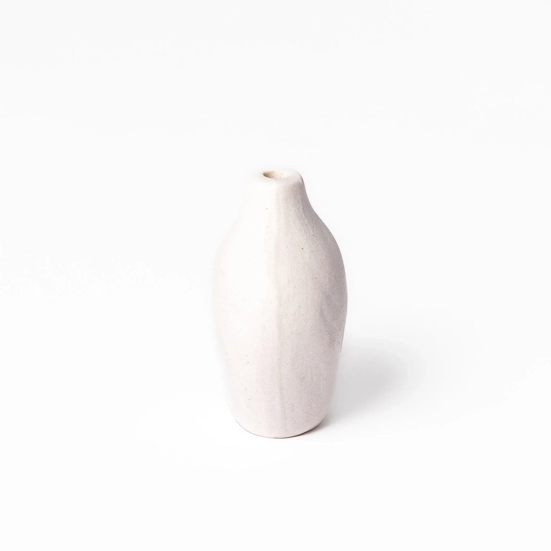 White ceramic bud vase with dried flowers, perfect for adding simple, elegant Japanese-inspired decor to any space.