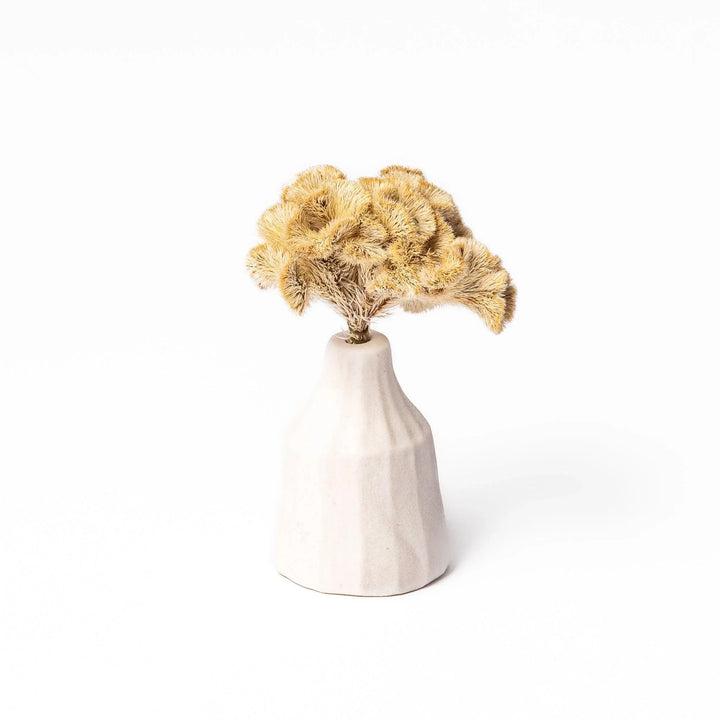 White ceramic bud vase with dried flowers, perfect for adding simple, elegant Japanese-inspired decor to any space.