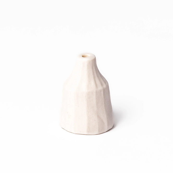 White ceramic bud vase with dried flowers, perfect for adding simple, elegant Japanese-inspired decor to any space.