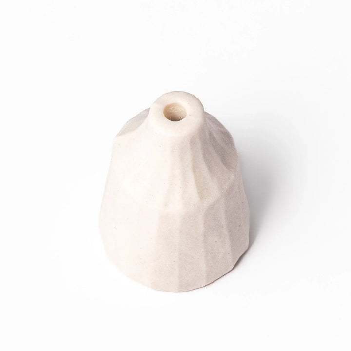 White ceramic bud vase with dried flowers, perfect for adding simple, elegant Japanese-inspired decor to any space.