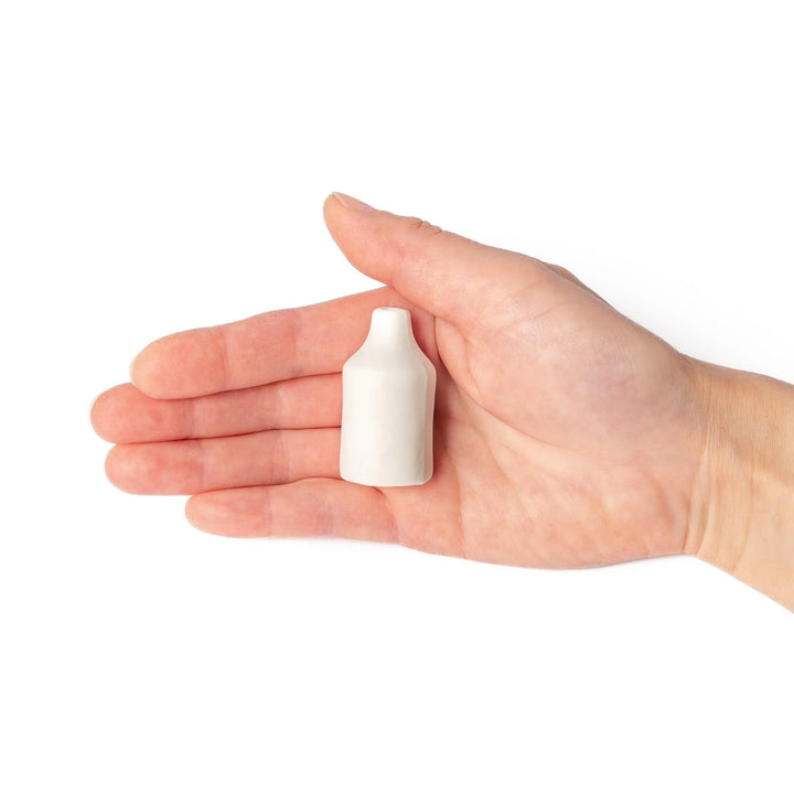 White ceramic bud vase with dried flowers, perfect for adding simple, elegant Japanese-inspired decor to any space.