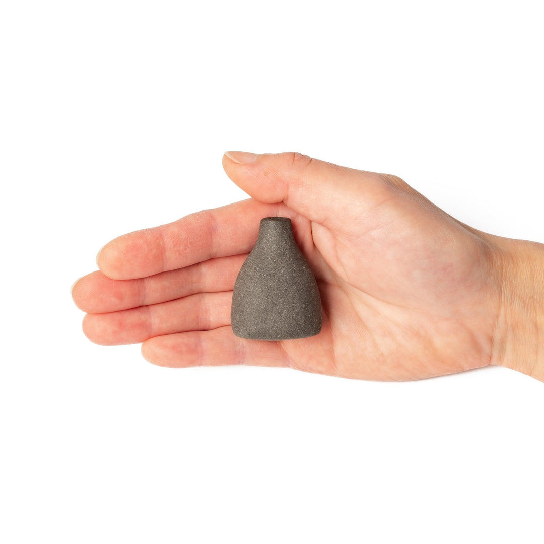 Dark ceramic bud vase with dried flowers, ideal for bringing a modern Japanese touch to any room or table.