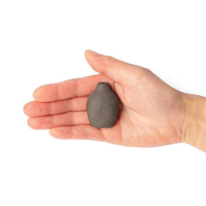 Dark ceramic bud vase with dried flowers, ideal for bringing a modern Japanese touch to any room or table.