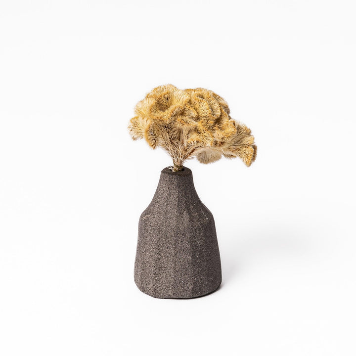 Dark ceramic bud vase with dried flowers, ideal for bringing a modern Japanese touch to any room or table.