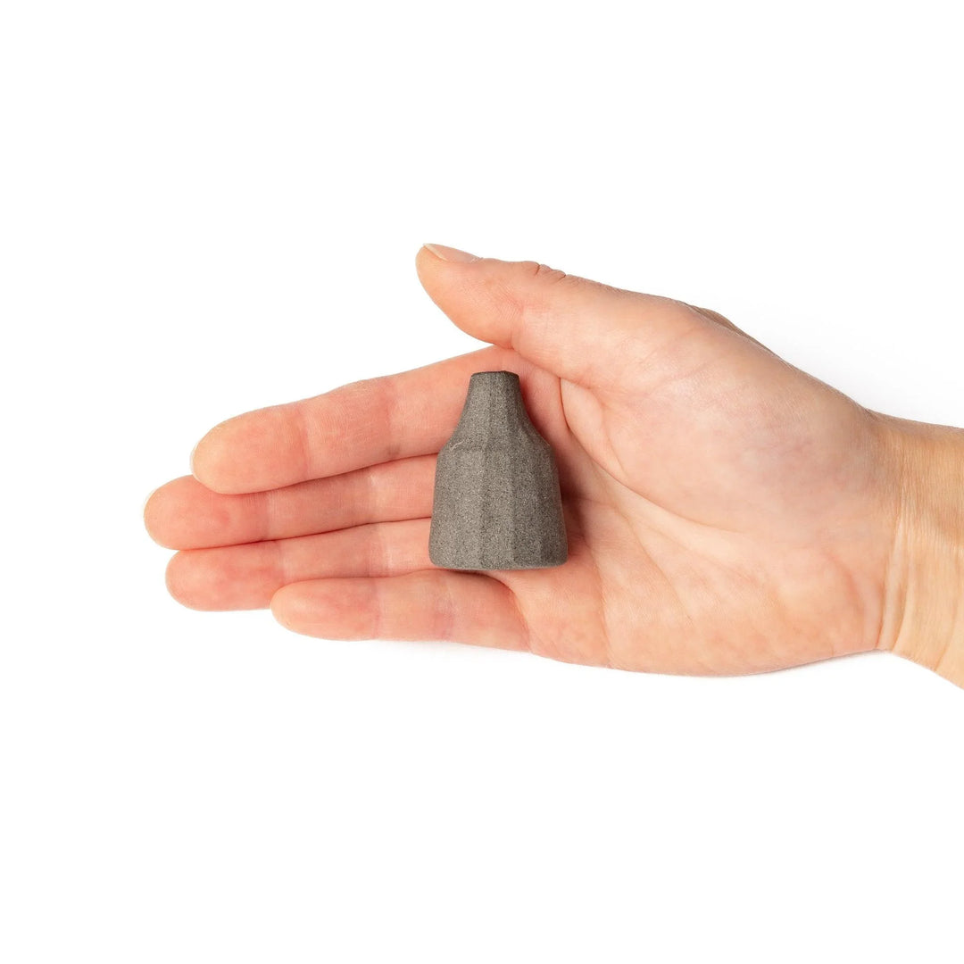 Dark ceramic bud vase with dried flowers, ideal for bringing a modern Japanese touch to any room or table.