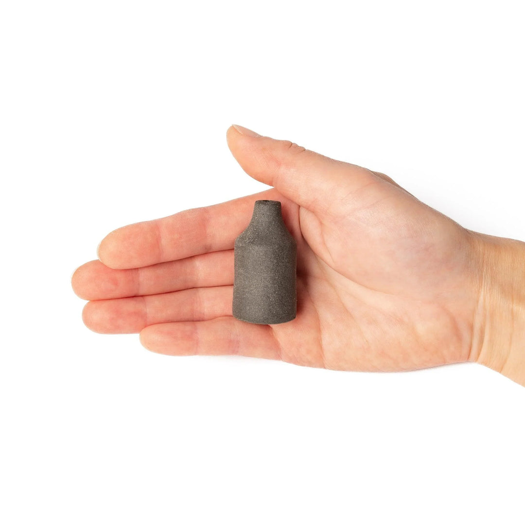 Dark ceramic bud vase with dried flowers, ideal for bringing a modern Japanese touch to any room or table.