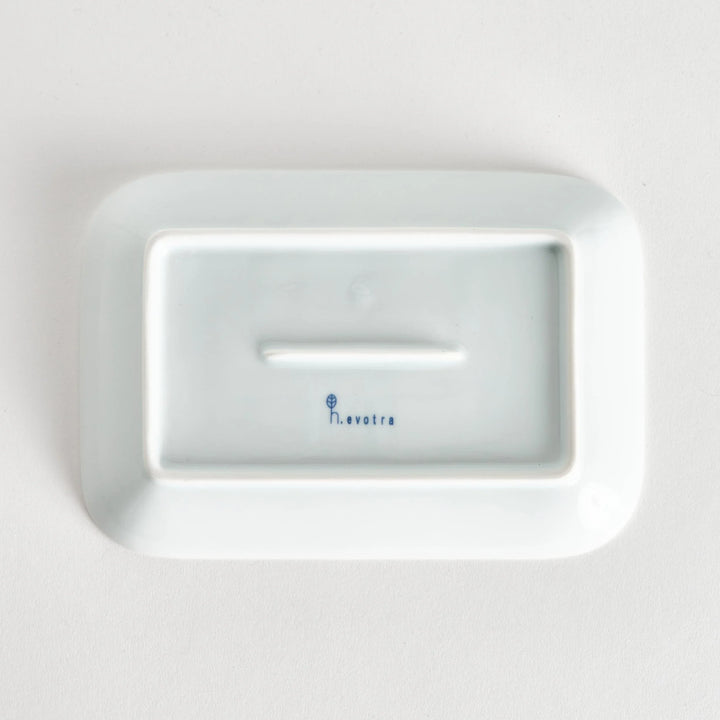 Five piece Modern Indigo Circle set with cups plates and dish featuring navy blue radiating circle design.