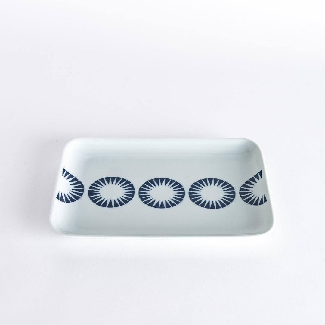 Modern Indigo Circle dinner plate with navy blue radiating circle motif on white porcelain for elegant dining.