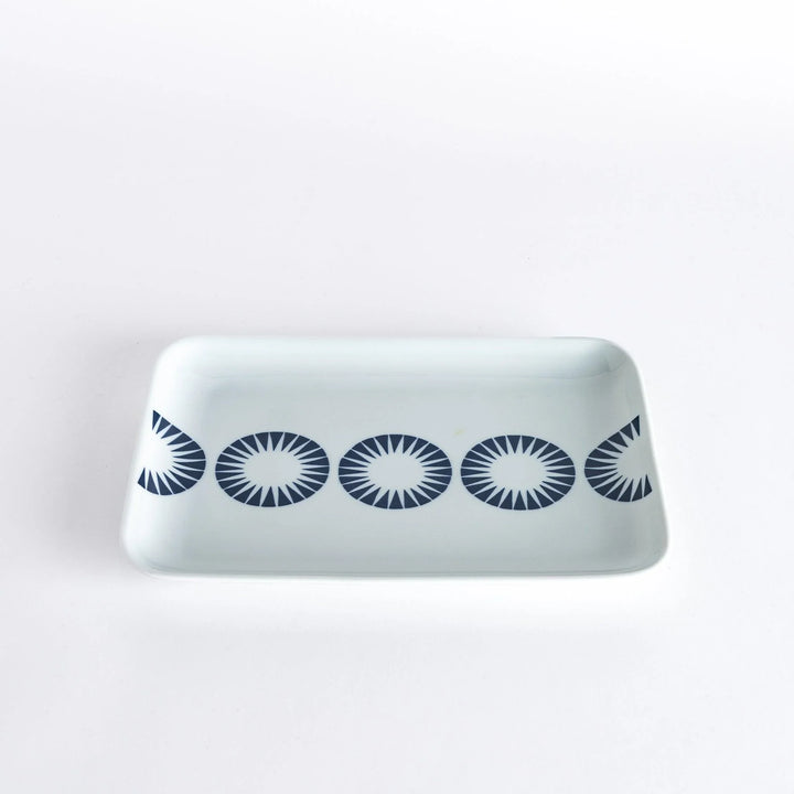 Modern Indigo Circle dinner plate with navy blue radiating circle motif on white porcelain for elegant dining.