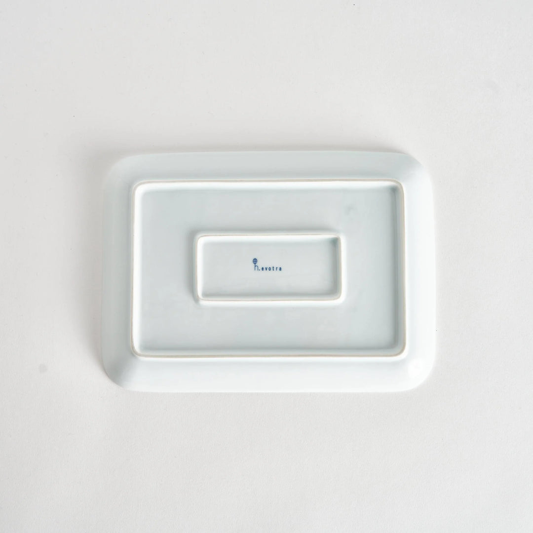 Bottom view of the Modern Indigo Circle Dinner Plate with a visible maker’s mark, emphasizing the craftsmanship.