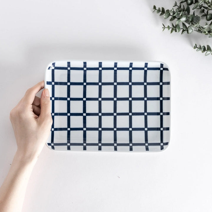 Modern Indigo Lattice dinner plate featuring bold geometric indigo lattice pattern on white porcelain.