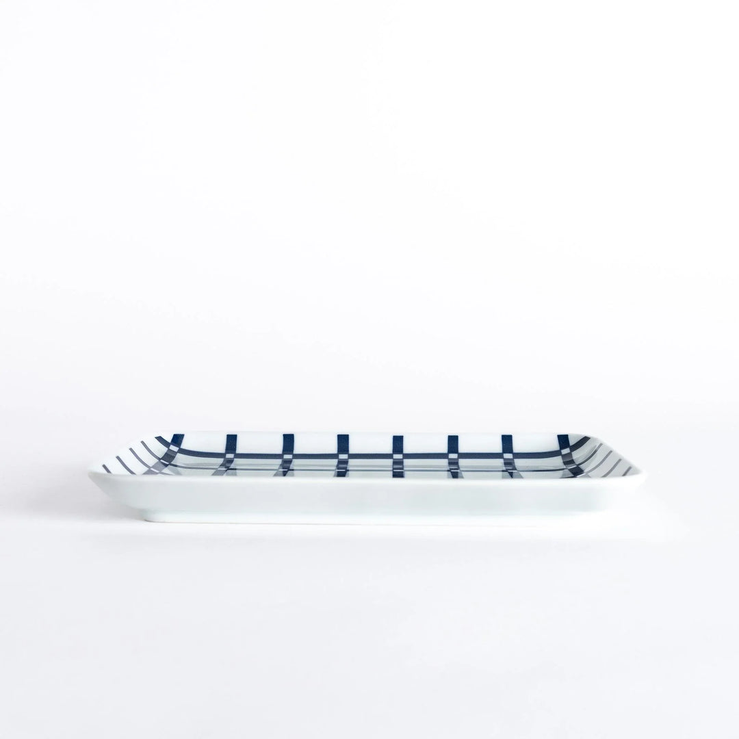 Modern Indigo Lattice dinner plate featuring bold geometric indigo lattice pattern on white porcelain.