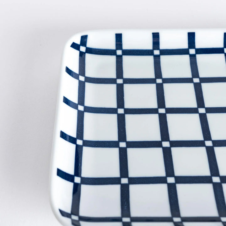 Modern Indigo Lattice dinner plate featuring bold geometric indigo lattice pattern on white porcelain.