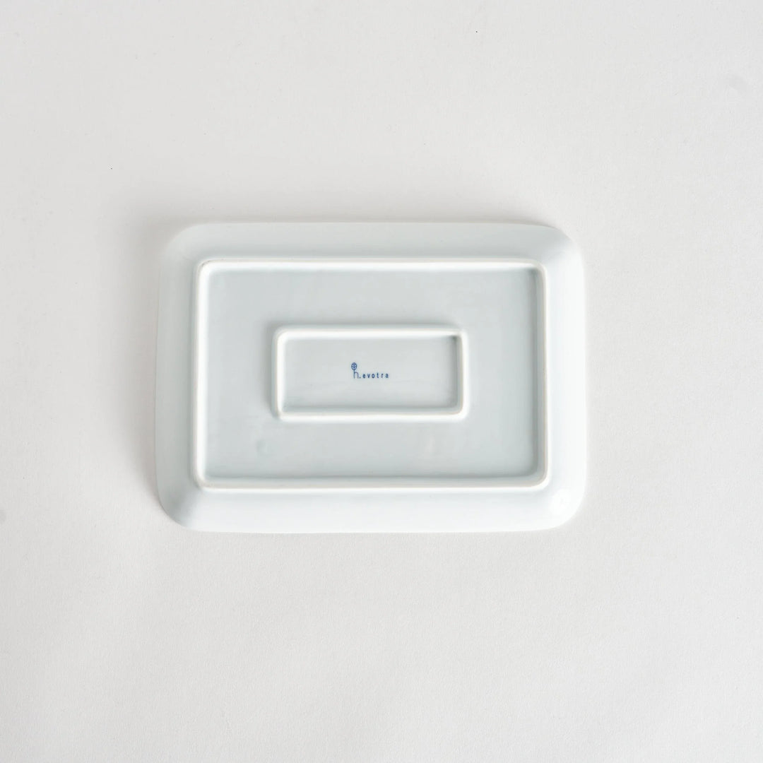 Modern Indigo Pine dinner plate with elegant blue pine branch motif on white porcelain for refined dining.