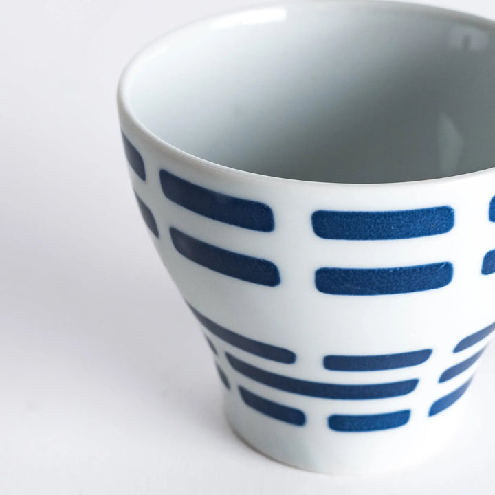 Close-up of the Modern Indigo River Cup with navy blue stripes in a sleek flared design.