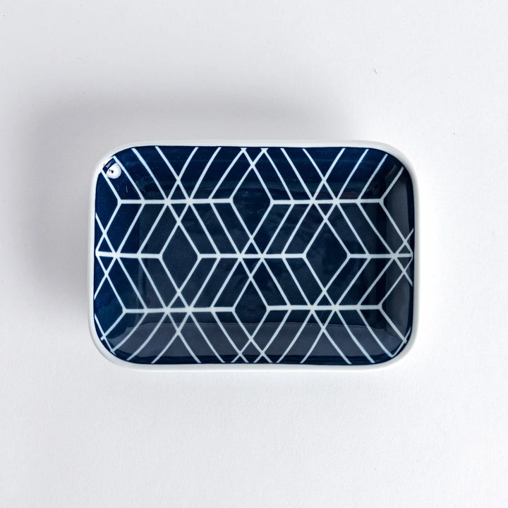 Rectangular dessert plate with bold indigo tile pattern featuring white outlined diamonds on deep blue.