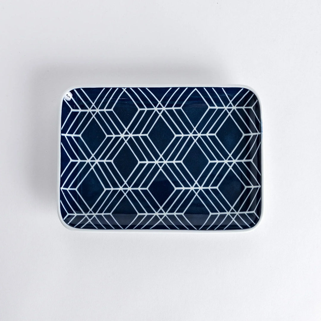 Modern Indigo Tile dinner plate with geometric white diamond pattern on deep navy blue background.