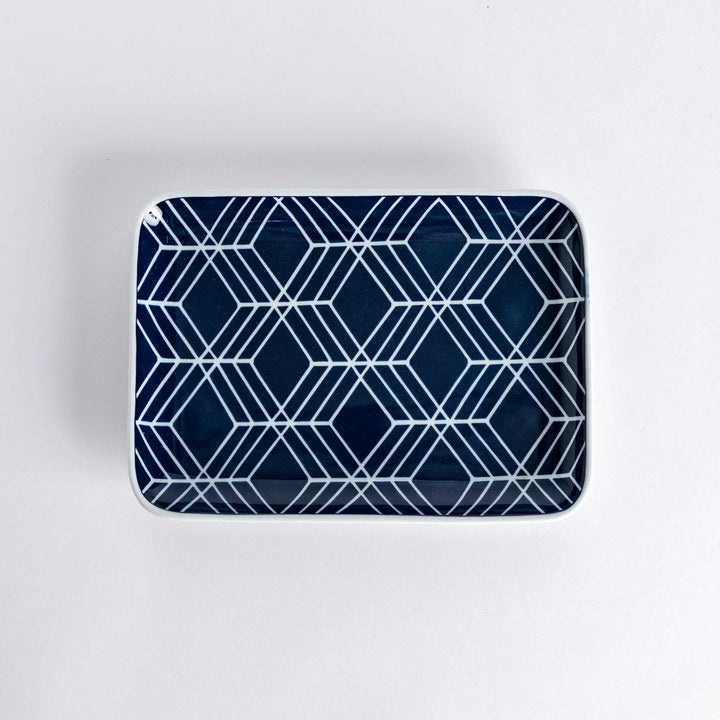 Modern Indigo Tile dinner plate with geometric white diamond pattern on deep navy blue background.