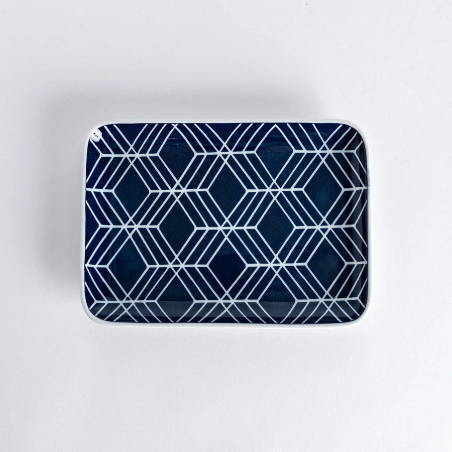 Modern Indigo Tile dinner plate with geometric white diamond pattern on deep navy blue background.