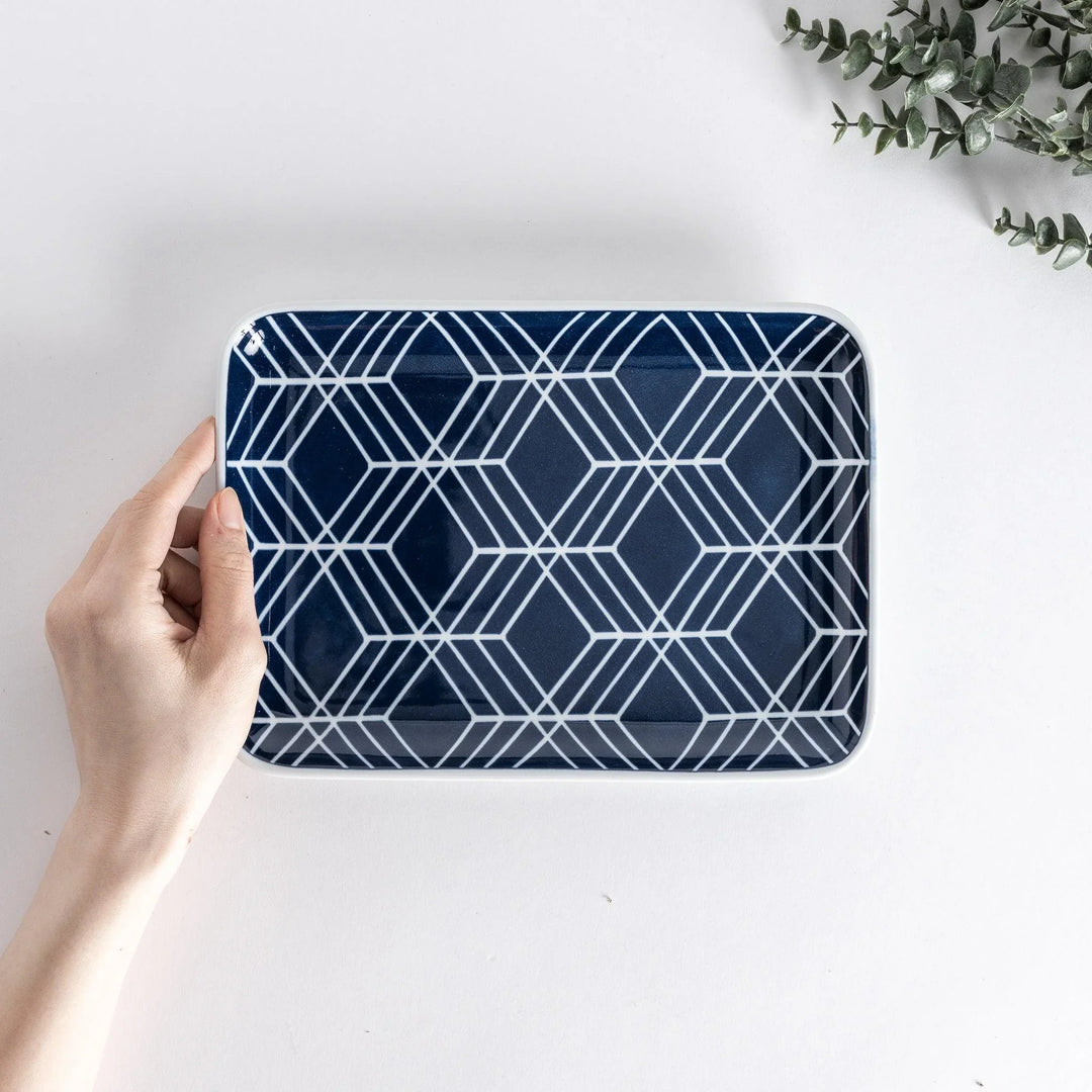 Modern Indigo Tile dinner plate with geometric white diamond pattern on deep navy blue background.
